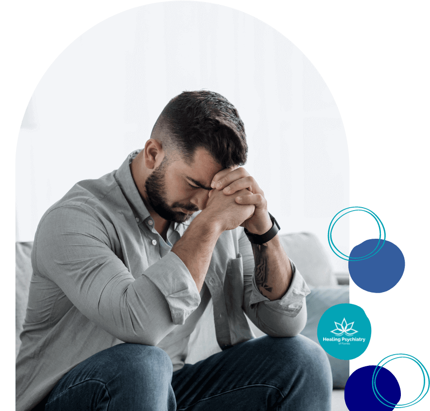 Anxiety counseling near altamonte springs, florida 1 Man sitting with his head in his hands, looking distressed, representing the need for anxiety treatment in Altamonte Springs