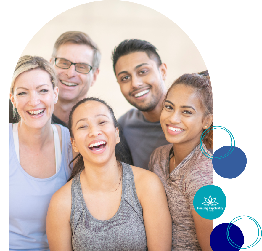 Diverse group of people smiling together in a fitness class, embodying the community support found at Altamonte Springs depression therapy groups.