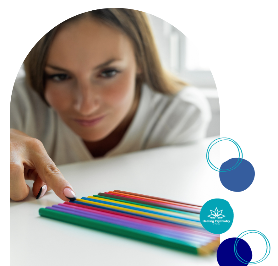 A woman aligning colored pencils; logo for Healing Psychiatry. OCD therapy near Altamonte Springs, Florida.