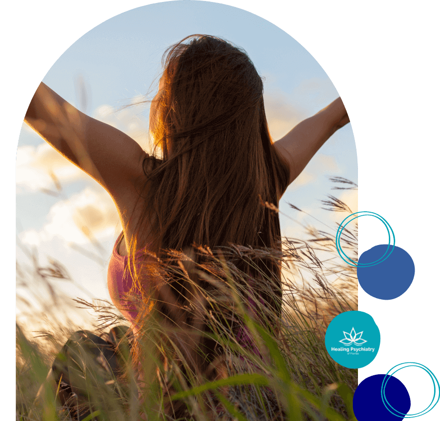 therapist for depression altamonte springs, florida Woman with arms outstretched in a field at sunset, capturing the essence of freedom and recovery through Altamonte Springs depression treatment.