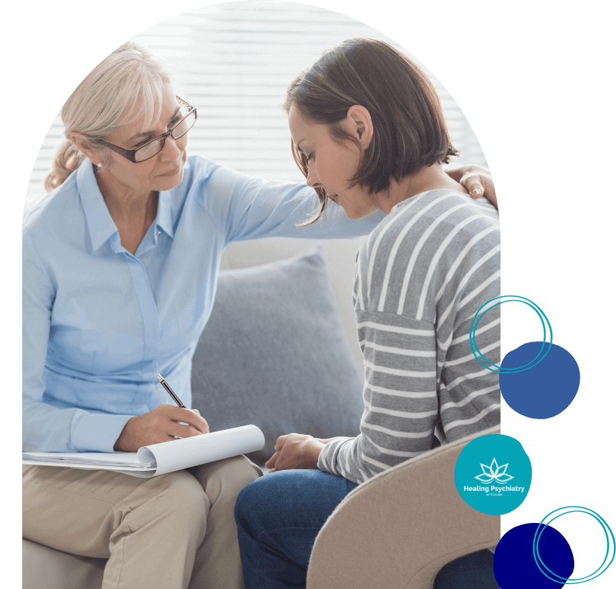Sanford Psychiatric Services Empathetic Sanford therapist engages warmly with a client, notepad in hand, symbolizing Healing Psychiatry's supportive care.