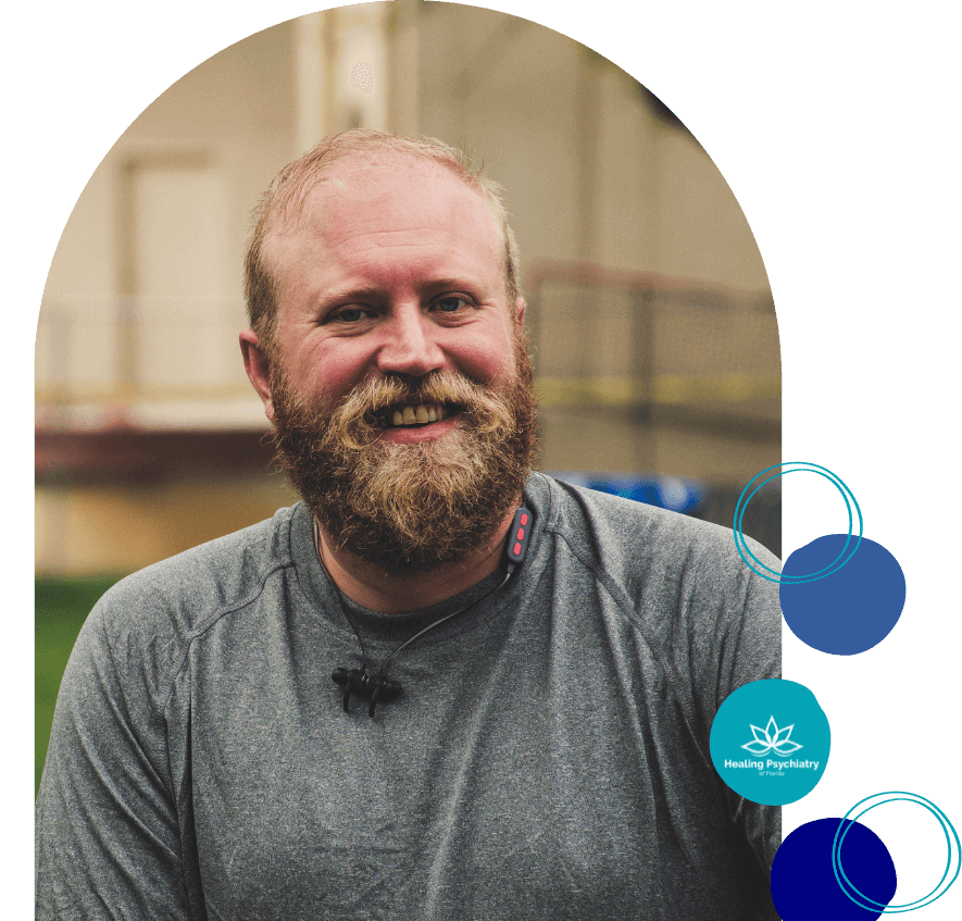 Happy bearded man smiling, representing the positive outcomes of anger management treatment in Altamonte Springs.