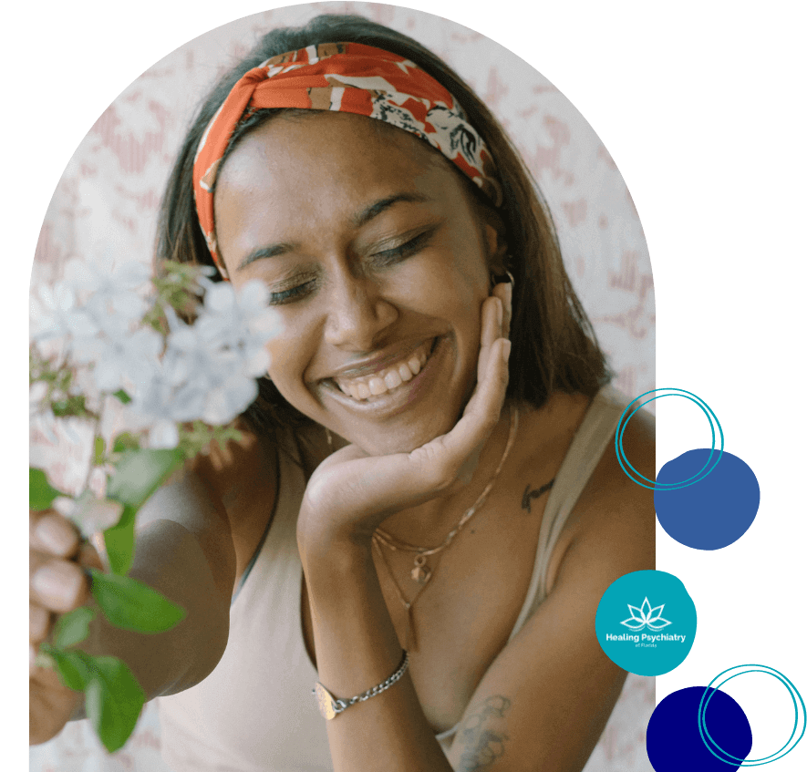 Smiling woman holding flowers, representing anger management treatment in Altamonte Springs.