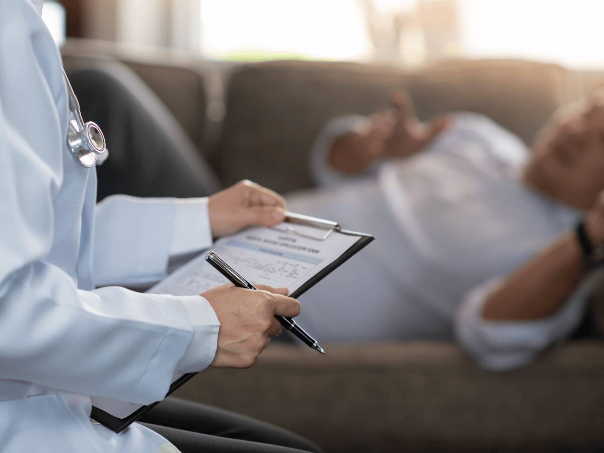 ADHD as an introvert blog banner showing a lonely girl sitting on a bridge looking out at the ocean