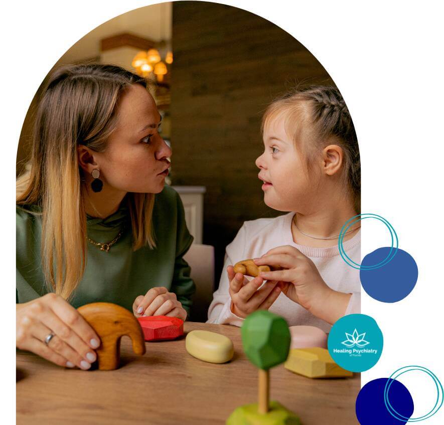 Therapist interacting with a young girl with Down syndrome during a therapy session, using colorful wooden toys, with Healing Psychiatry of Florida branding.
