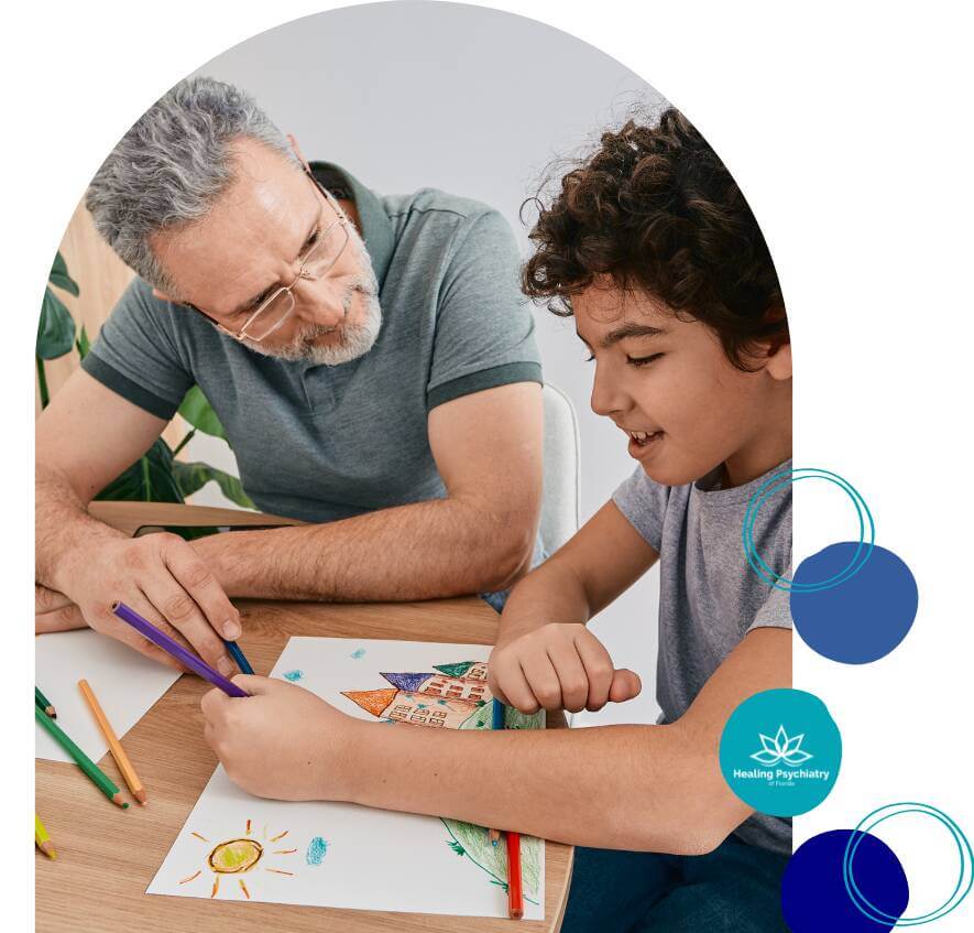 A child and therapist engaging in a creative art activity during a therapy session.