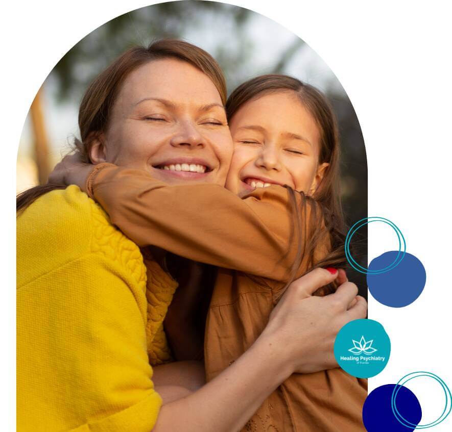 children therapy (1) A smiling mother and daughter embrace each other warmly with their eyes closed, radiating joy and connection.