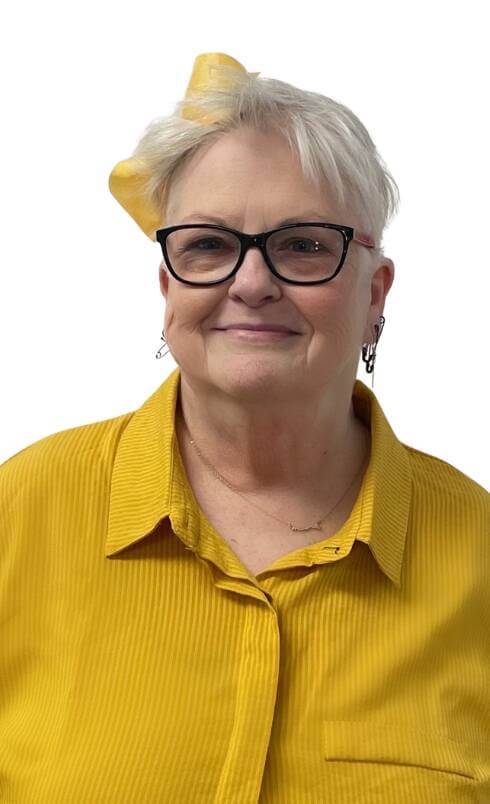 Portrait of Alice Portland wearing a yellow shirt and glasses, smiling against a white background. Licensed Mental Health Counselor with over 20 years of clinical experience working with children, adults, and the geriatric population. 